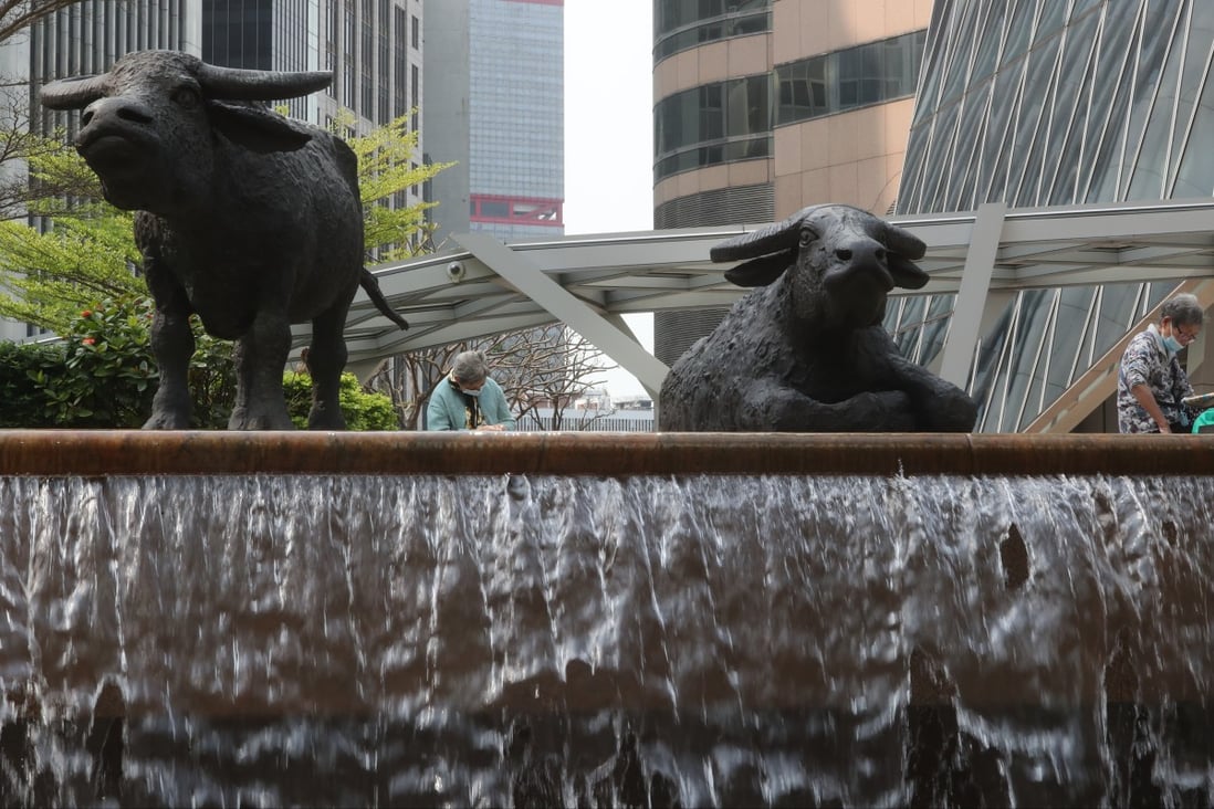 Two sculptures of the bull at the Hong Kong stock exchange’s location at Exchange Square in Central on March 12, 2021. Photo: Edmond So