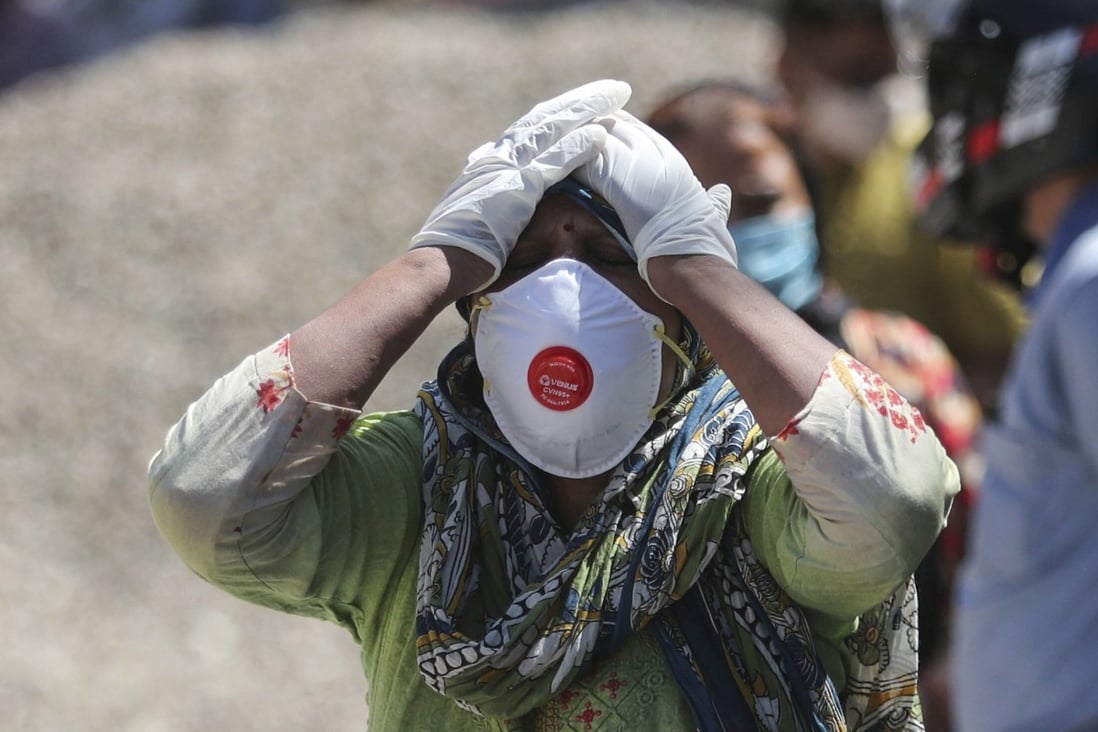 A relative of a Covid-19 victim mourns at a crematorium in Jammu, India, on April 25. India’s Serum Institute, in collaborating with AstraZeneca, has complete access to all the necessary vaccine IP, yet has been unable to meet local and international needs. Photo: AP