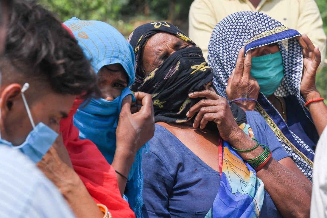 Relatives grieve as they arrive for the cremation of their loved one in Moradabad on May 5, 2021. Photo: AFP
