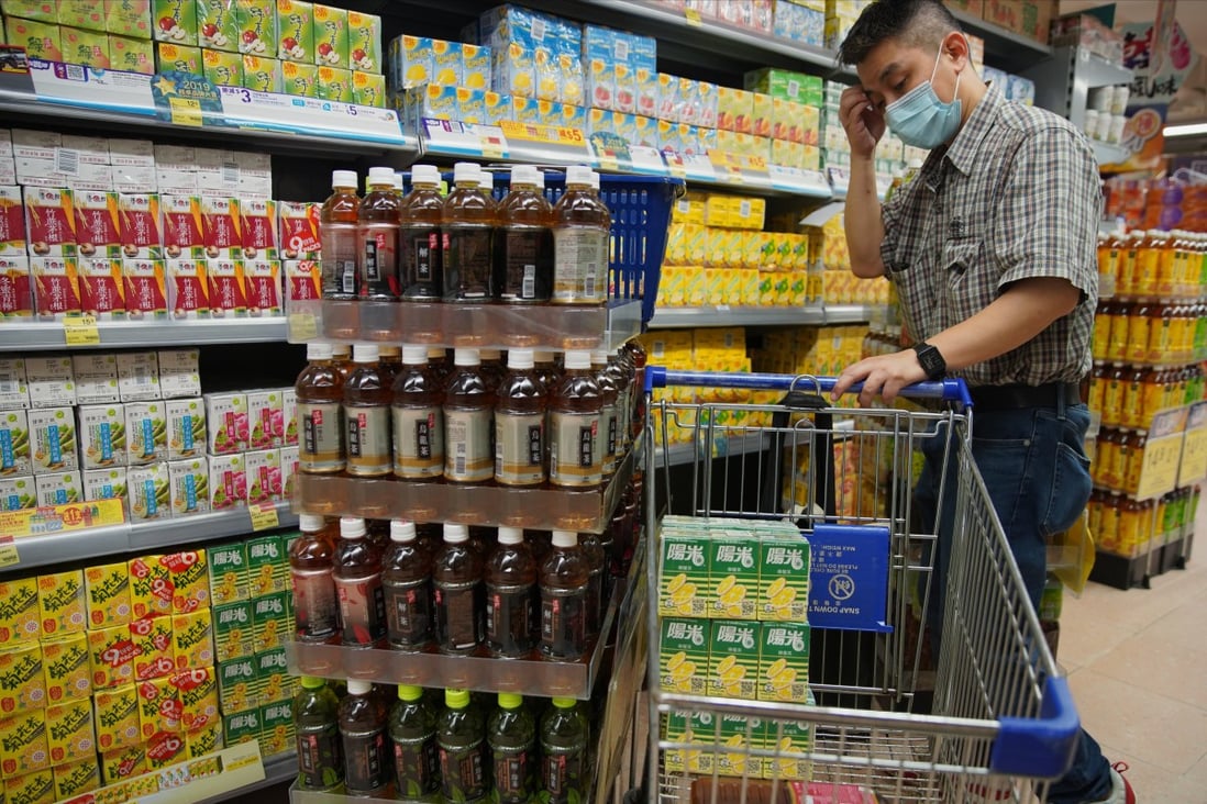 A shopper visits the packaged drinks aisle at a supermarket in August last year. If the rebate value is set too low, consumers are likely to simply continue to litter or at best dispose of empty drink containers to the city’s already exploding landfills. Photo: Winson Wong