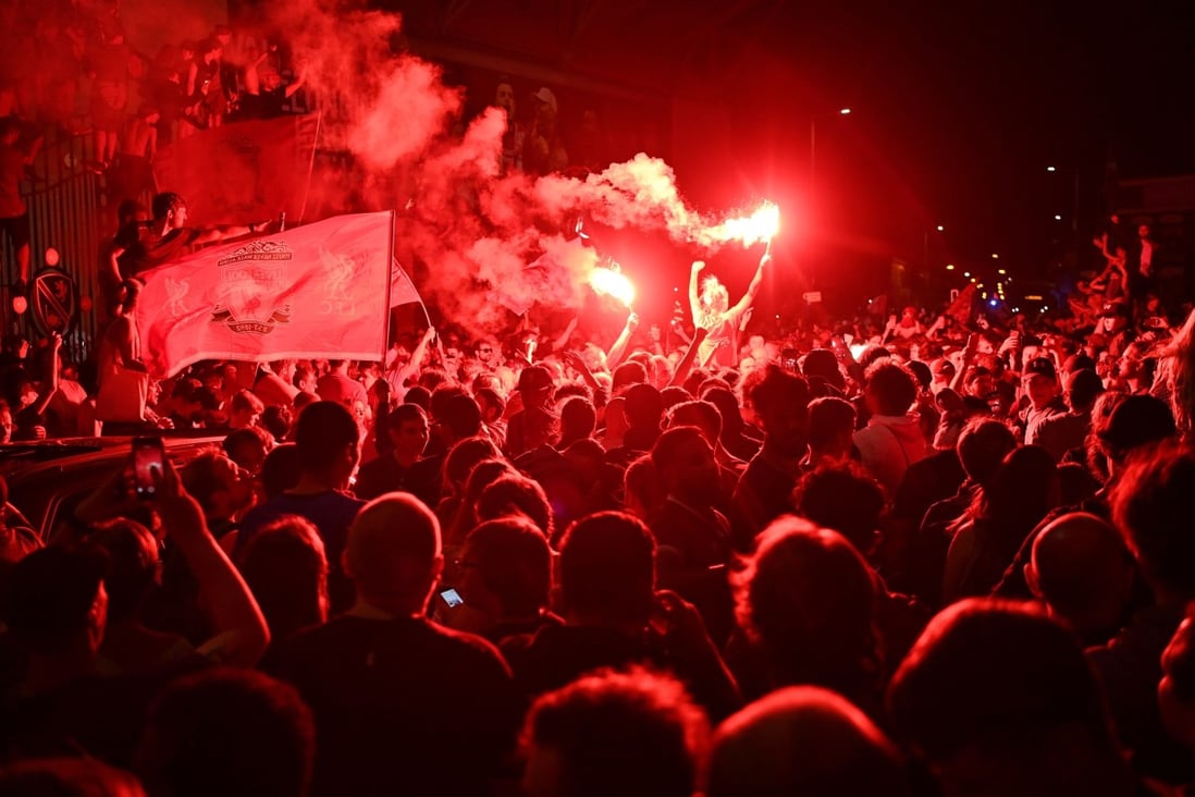 Liverpool fans celebrate outside Anfield stadium after their team won the Premier League title in June, 2020. Photo: AFP