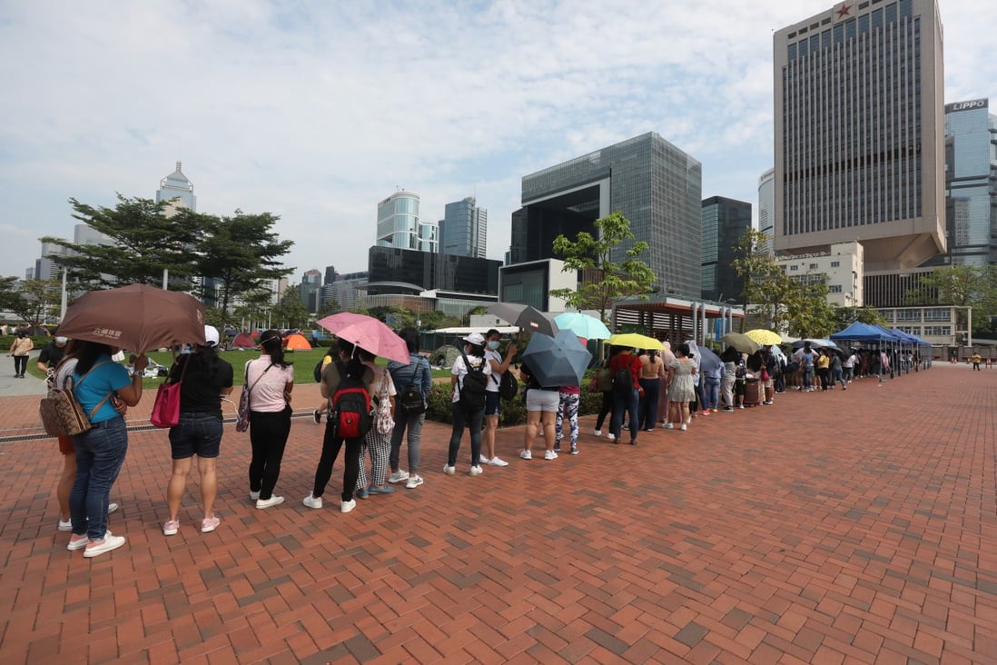Domestic workers queue for mandatory Covid-19 tests at Tamar Park in Admiralty on May 1. Photo: Xiaomei Chen