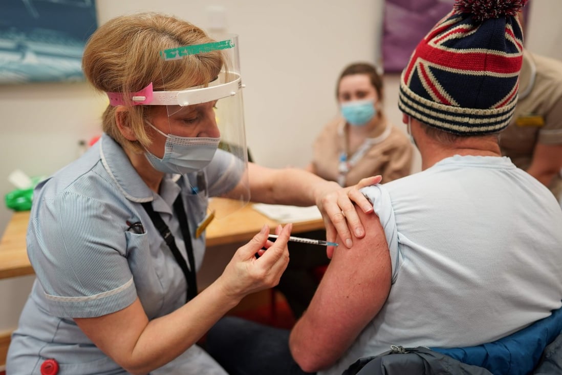 An essential worker receives the Pfizer-BioNTech Covid-19 vaccine at the International Centre for Life in Newcastle upon Tyne, northeast England, on January 9. Photo: AFP