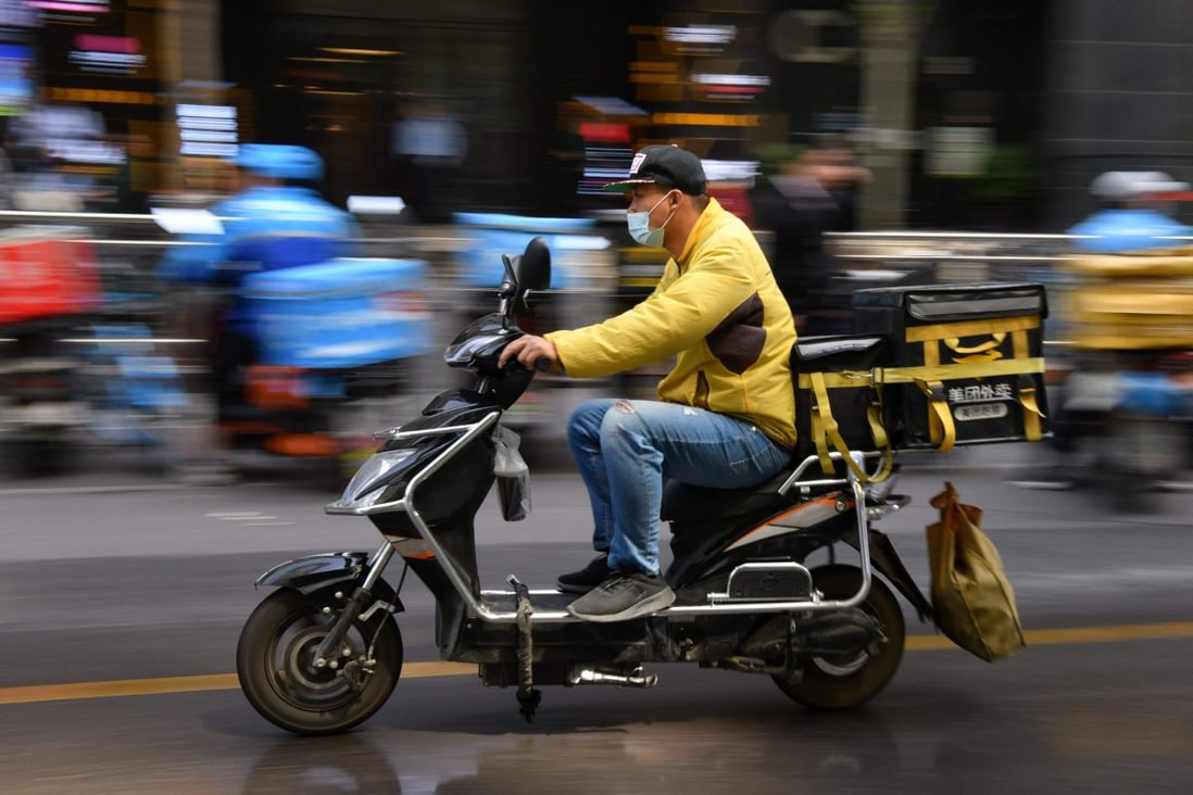 A delivery rider for Meituan heads out for a pickup in Beijing. The operator of China's biggest on-demand food delivery service paced the retreat of Chinese tech stocks on May 11, 2021. Photo: Agence France-Presse