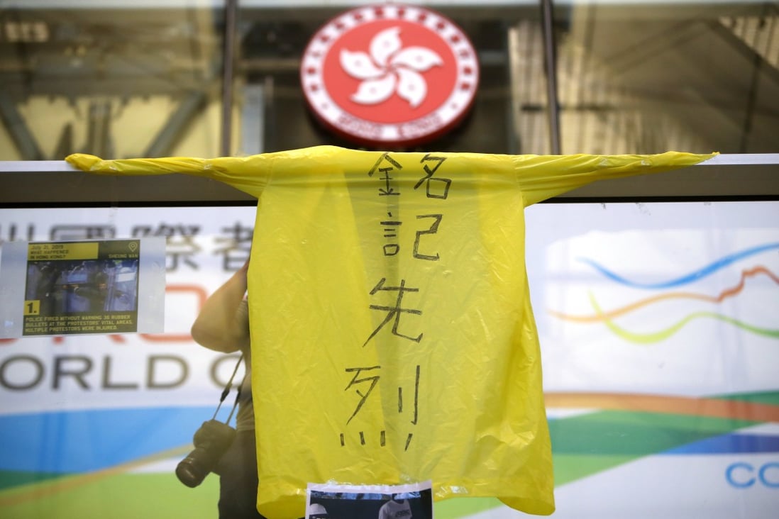 A yellow raincoat is displayed during a protest in 2019 to pay respect to Marco Leung. Photo: Winson Wong