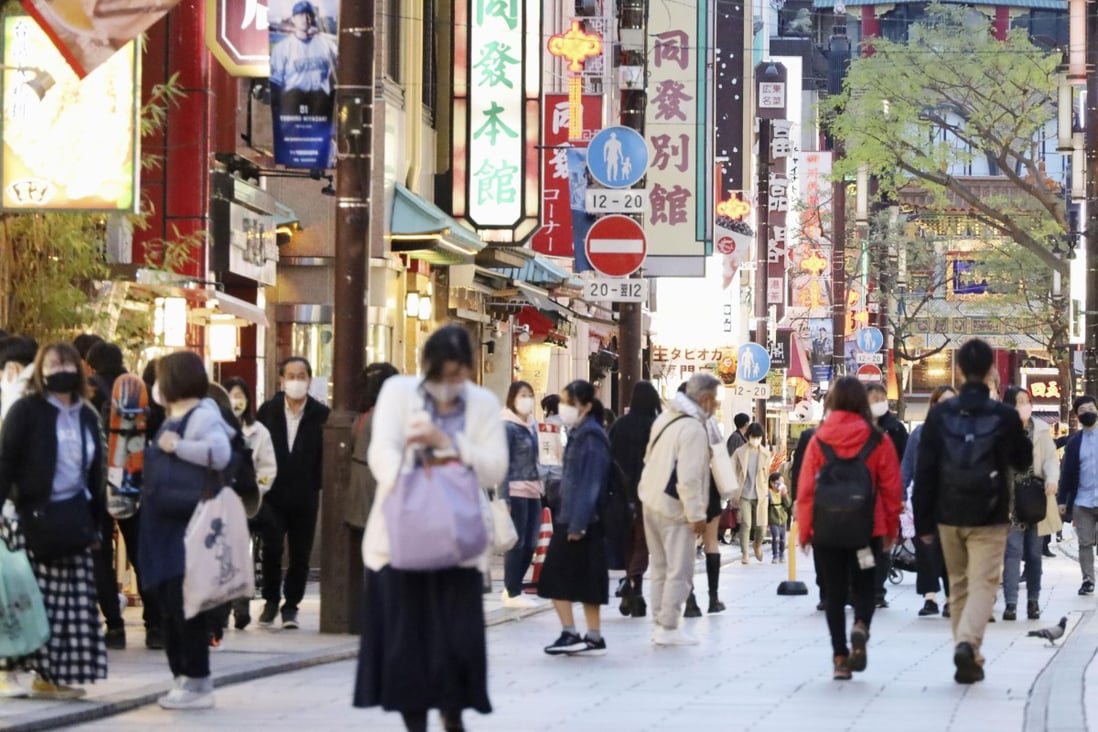 People wearing masks walk in Chinatown in Yokohama on April 15. Japan is experiencing a fourth wave of Covid-19 infections. Photo: Kyodo