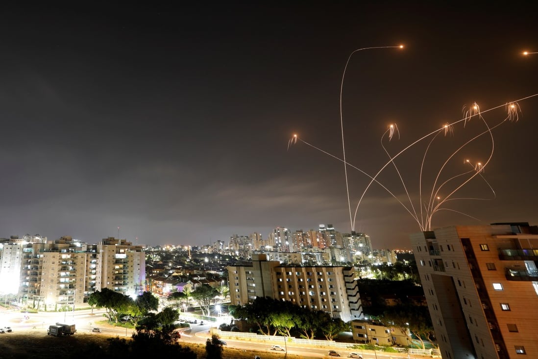 Streaks of light are seen as Israel's Iron Dome anti-missile system intercepts rockets launched from the Gaza Strip towards Israel on Monday. Photo: Reuters