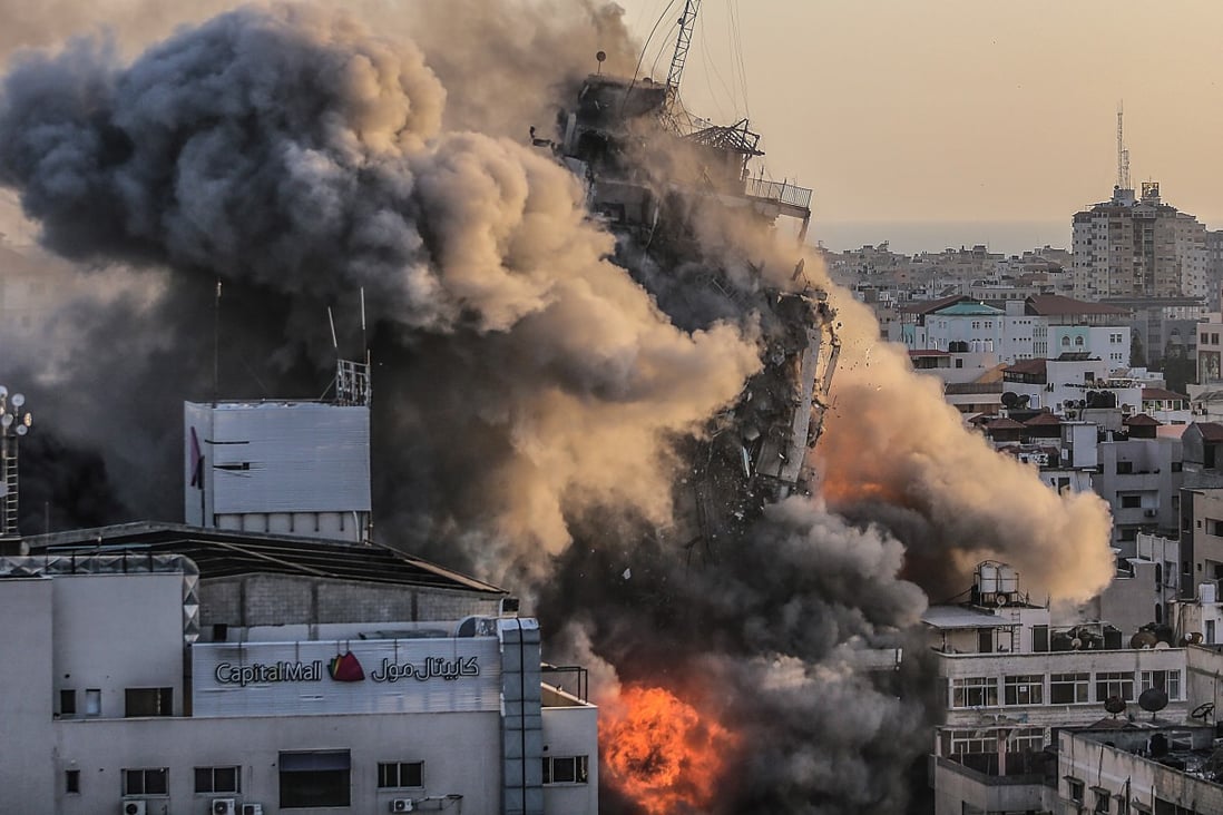 Smoke and flames rise after an Israeli strike on a building in Gaza City, on Wednesday. Photo: EPA