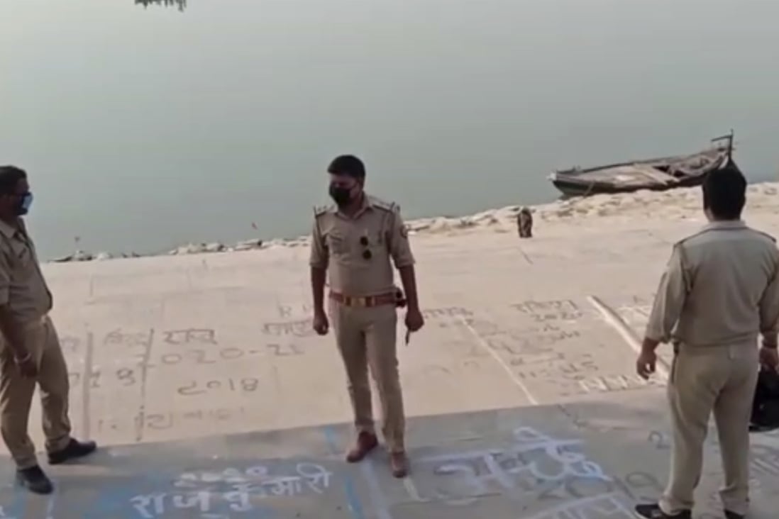 Police officials stand guard on the bank of the Ganges river where several bodies were found in Uttar Pradesh state in India on May 11. Photo: KK Productions via AP