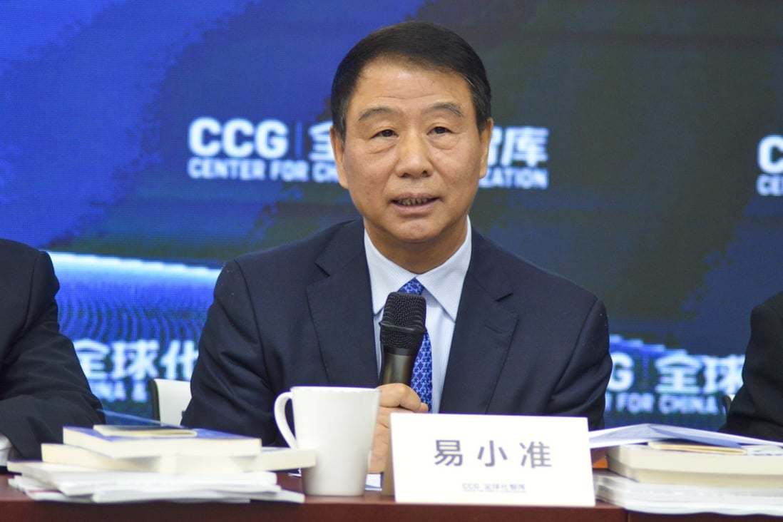 Yi Xiaozhun, who stepped down as deputy director general of the World Trade Organization last month, speaking at a seminar in Beijing on Friday. Photo: Centre for China and Globalisation