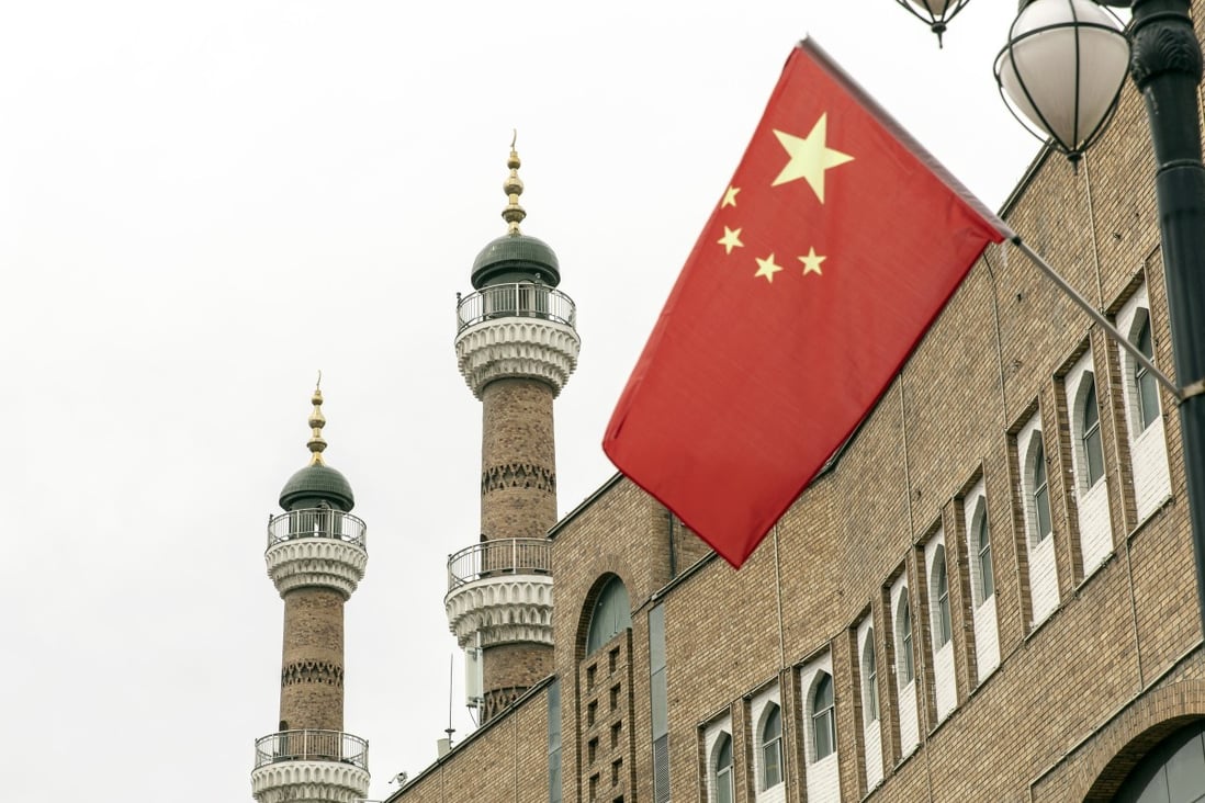 A Chinese national flag flies outside the Xinjiang International Grand Bazaar in Urumqi, Xinjiang, on May 12. China has told nations criticising its policies in Xinjiang to stop interfering in domestic affairs. Photo: Bloomberg