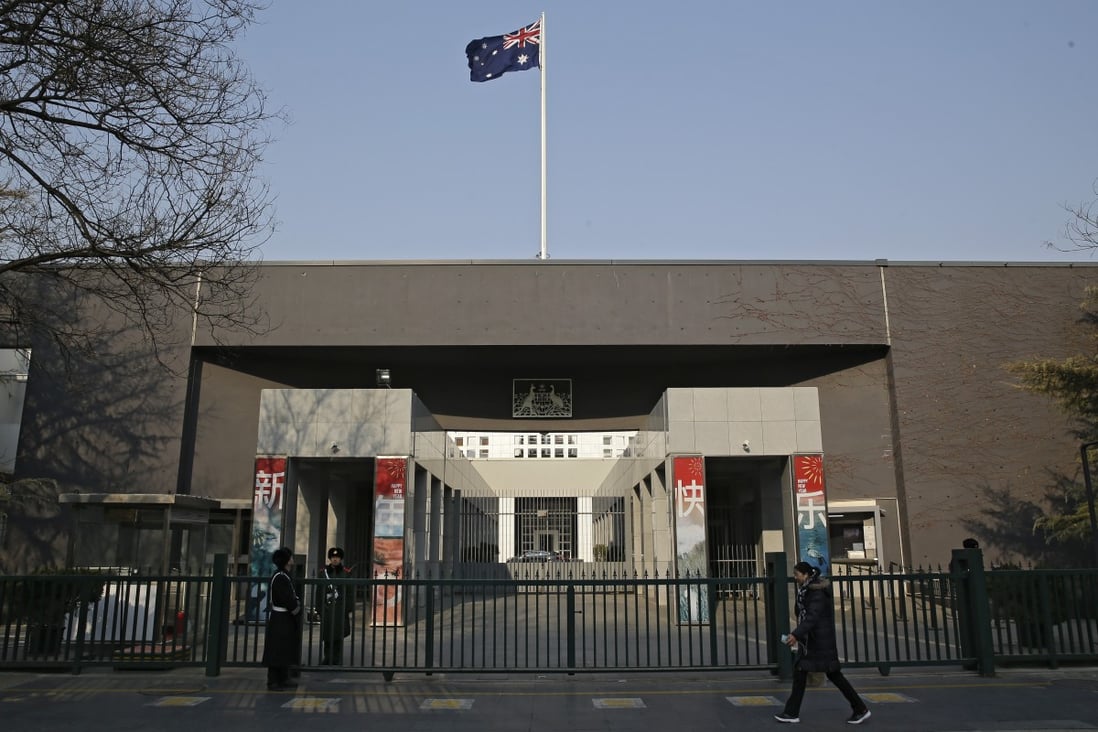 A woman walks by the Australian embassy in Beijing in January 2019. Citing Australian measures that “disrupt the normal exchanges and cooperation between China and Australia”, Beijing said last week it was indefinitely suspending high-level economic dialogue with Canberra. Photo: AP