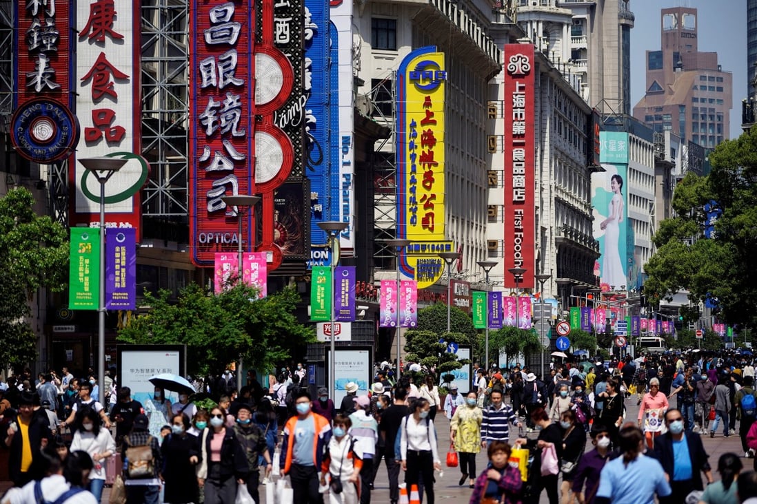 People walk along Nanjing Pedestrian Road, a main shopping area in Shanghai, on May 5. China's core consumer price index, which excludes food and energy, grew just 0.7 per cent year on year in April. Photo: Reuters