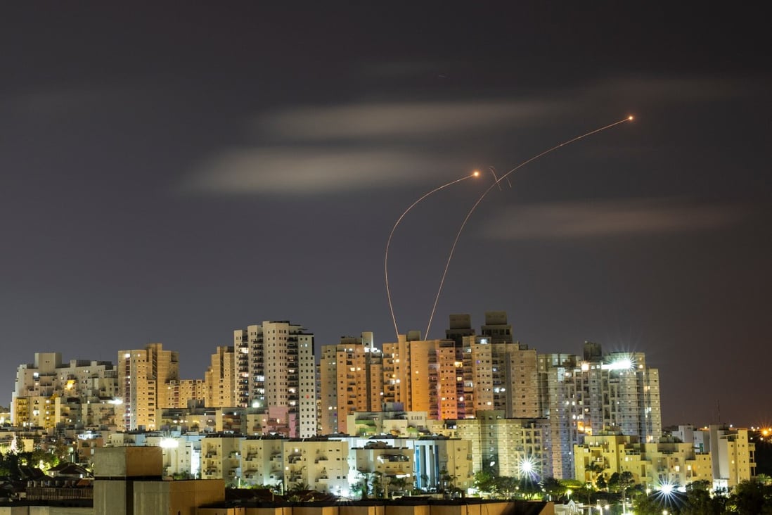 Streaks of light are seen as Israel’s Iron Dome anti-missile system intercepts rockets launched from the Gaza Strip towards Israel on Thursday. Photo: Reuters