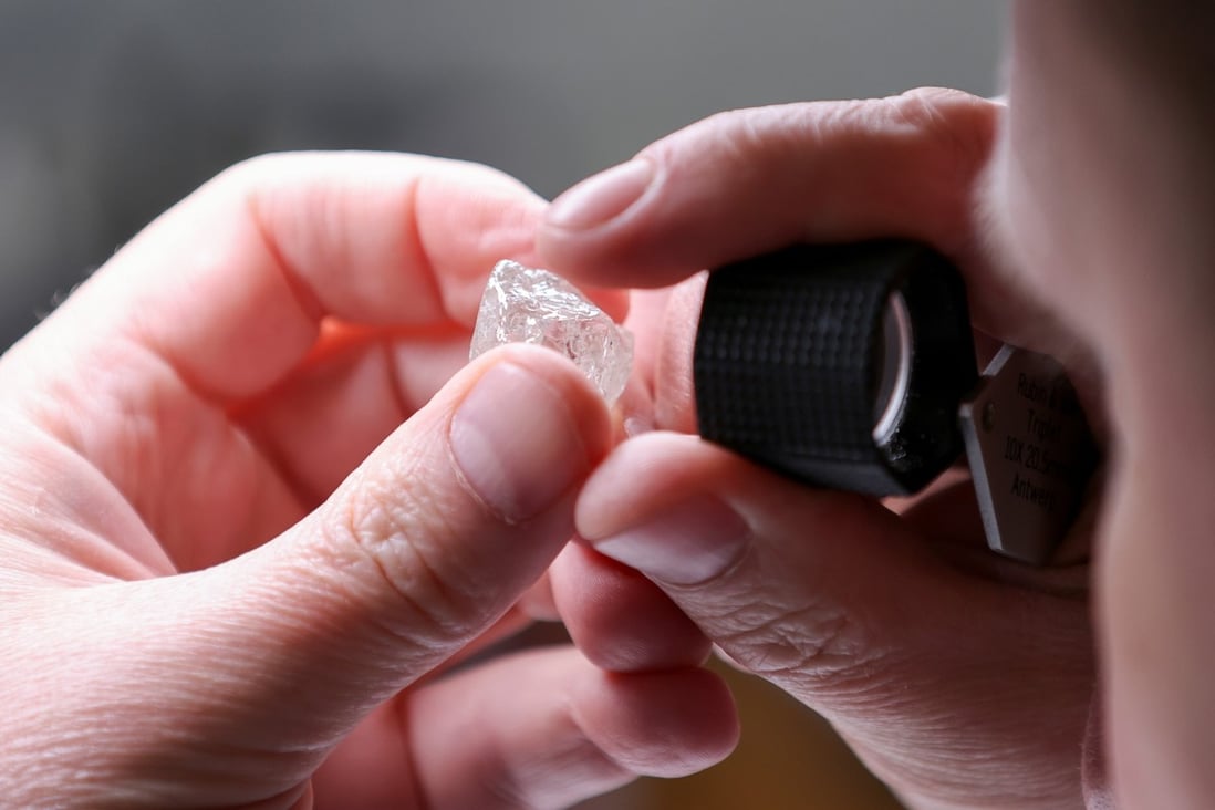 An employee holds a rough mined diamond at a factory in Moscow. Jewellery company Pandora’s decision to use only lab-grown diamonds on ethical grounds prompted pushback from diamond miners who say millions of people depend on income and welfare from mining the precious stones. Photo: Reuters