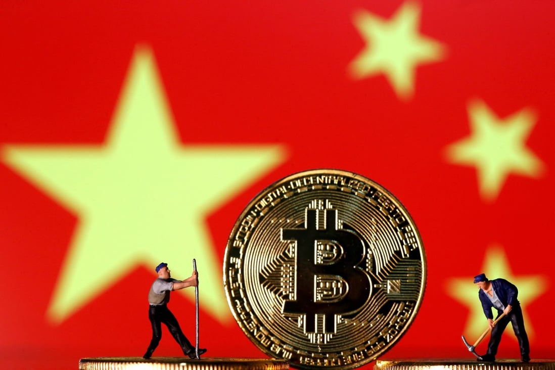 Small toy figurines are seen on representations of the bitcoin virtual currency displayed in front of an image of China's flag. Photo: Reuters