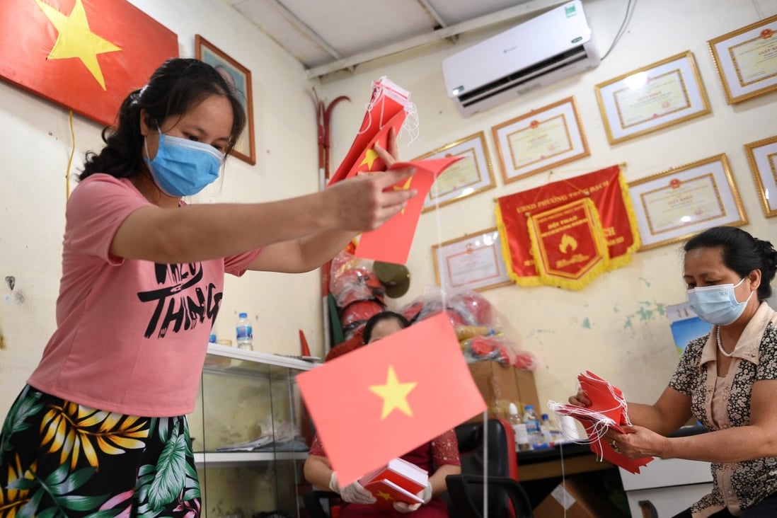 Local officials prepare a polling station ahead of upcoming elections in Hanoi. Photo: Reuters