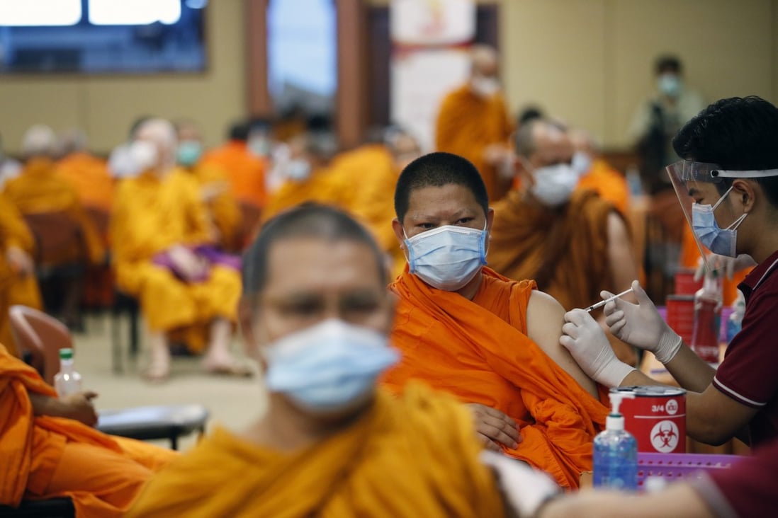 Buddhist monks in Bangkok, Thailand, get a shot of the Sinovac vaccine. Photo: EPA