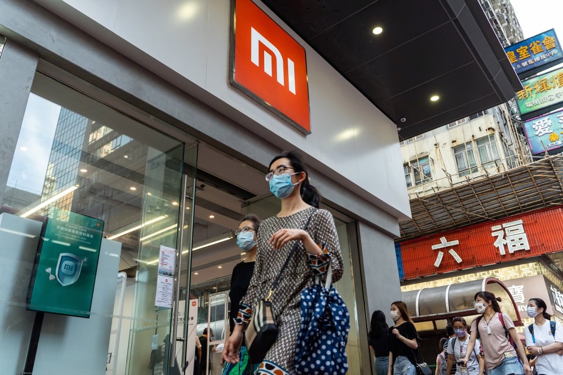 Pedestrians walk past a Xiaomi Corp store in Hong Kong on May 25, 2021. The Beijing-based company was ranked as the world’s third-biggest smartphone vendor in the quarter to March. Photo: Bloomberg