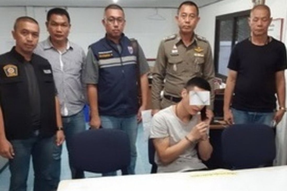 The sentence of Yu Xiaodong (centre, on phone), for deliberately pushing his wife off a cliff was reduced to 10 years after a second trial in Thailand. Photo: Royal Thai Police