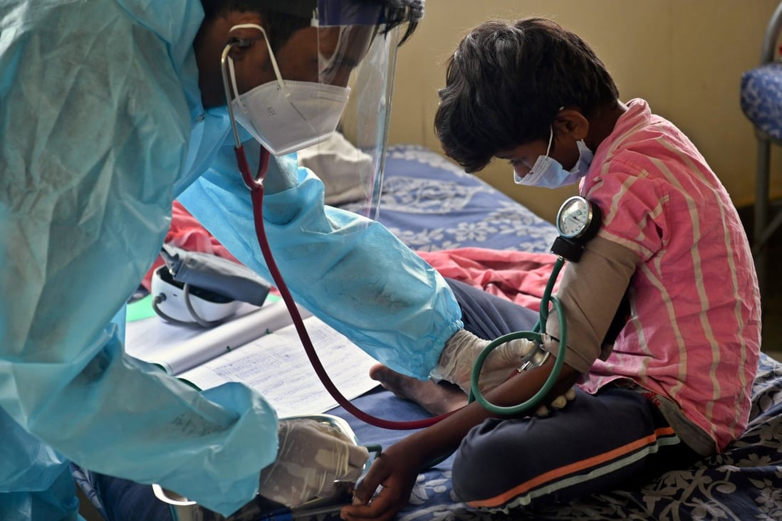 A doctor checks the blood pressure of a child at a Covid-19 care centre in Bangalore, India. Photo: Sopa Images via Zuma Wire/DPA