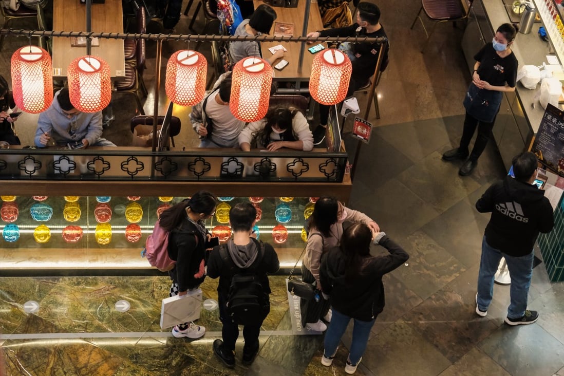 Customers line up to dine at a restaurant in Mong Kok in February, after Hong Kong’s social distancing rules were relaxed to allow four per table and dine-in services until 10pm. Photo: Edmond So