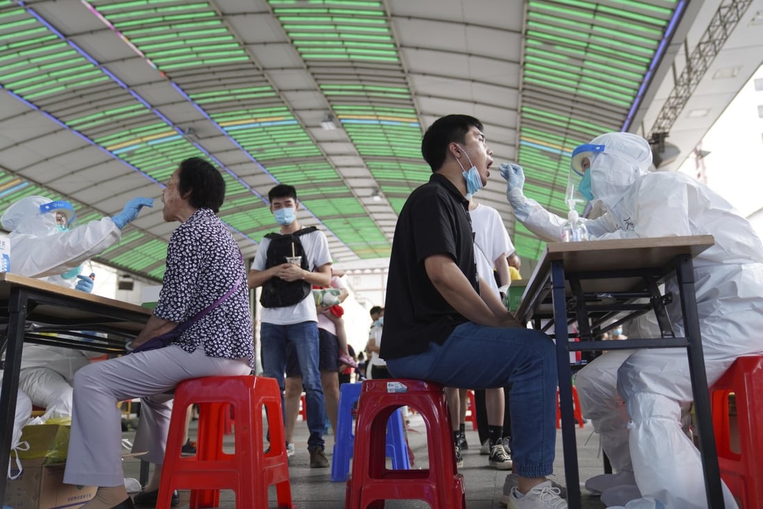 Residents get tested for the coronavirus in Guangzhou on Sunday. Photo: AP
