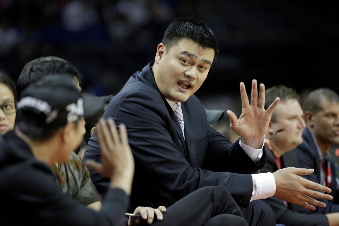 Former Houston Rockets player Yao Ming watches his old team play the New Orleans Pelicans in the NBA Global Games in Shanghai in 2016. Photo: Reuters