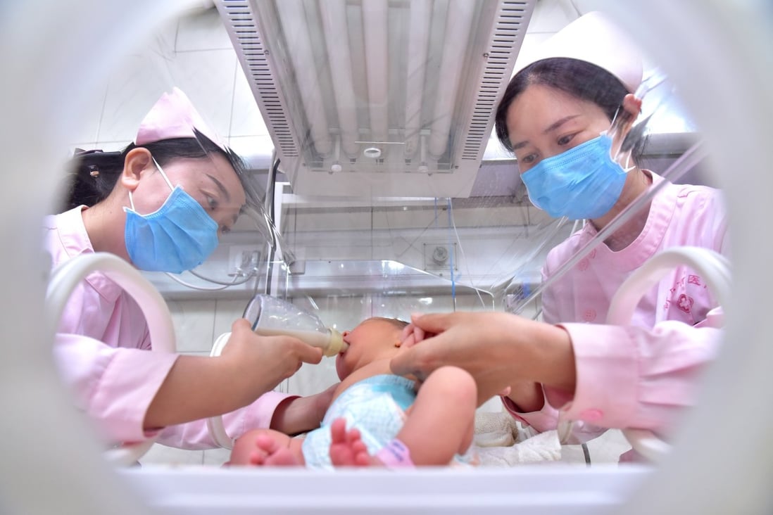 Nurses check and feed a baby at a hospital in north China’s Hebei province in May 2019. Chinese mothers gave birth to 12 million babies last year, down from 14.65 million in 2019. Photo: Xinhua