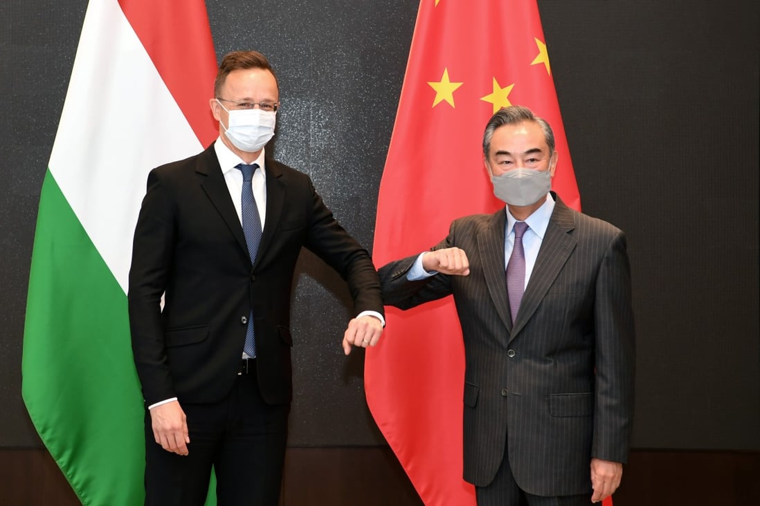 Chinese State Councillor and Foreign Minister Wang Yi greets Hungarian Minister of Foreign Affairs and Trade Peter Szijjarto, in Guiyang, Guizhou province, on Monday. Photo: Xinhua