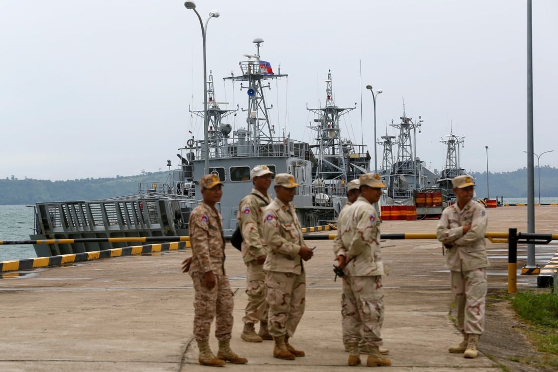 Sailors stand guard near petrol boats at the Cambodian Ream Naval Base in Sihanoukville. Photo: Reuters