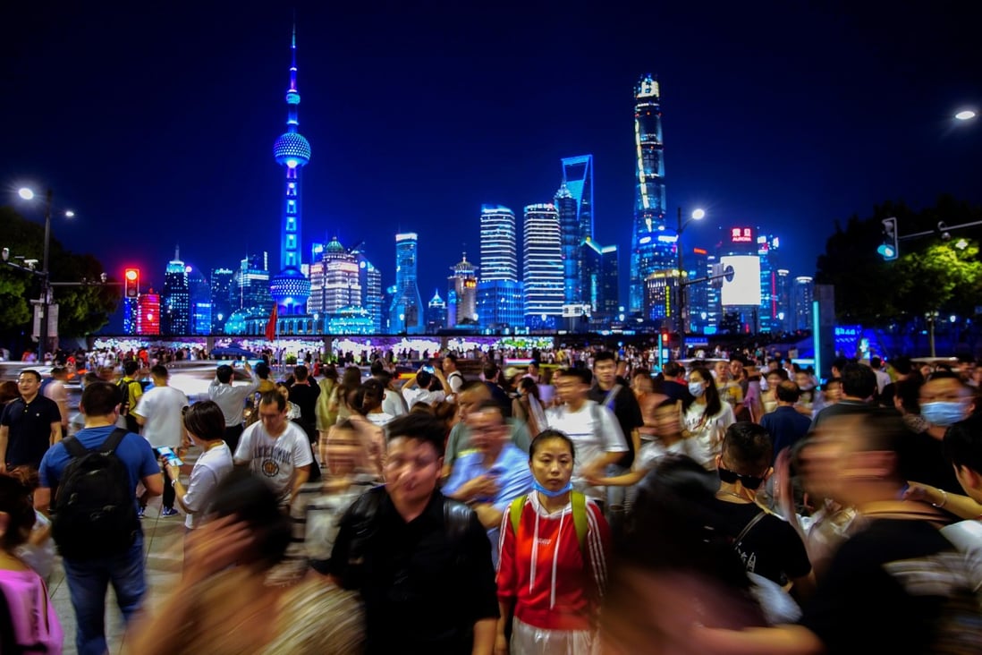 Crowds throng the Bund, Shanghai’s iconic promenade along the Huangpu river, against the dazzling backdrop of the Lujiazui financial district of Pudong on the other bank. Photo: Reuters