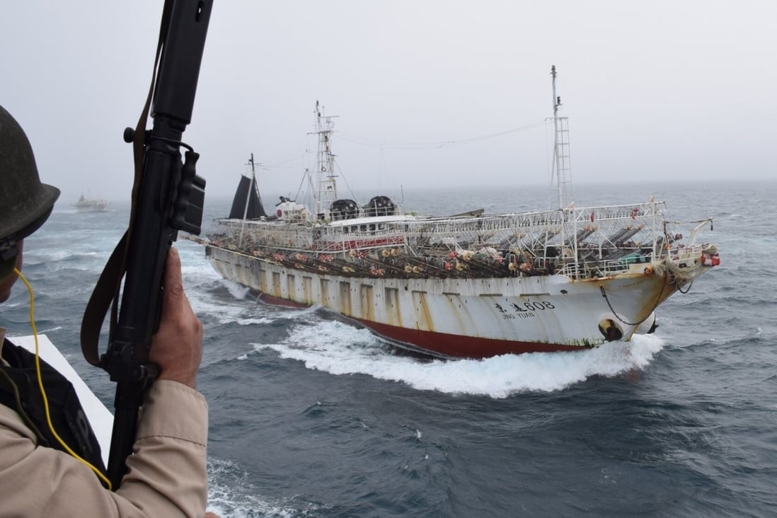 A Chinese fishing boat is seen off by Argentina’s coastguard after it was found fishing illegally in the country’s waters. Photo: AFP