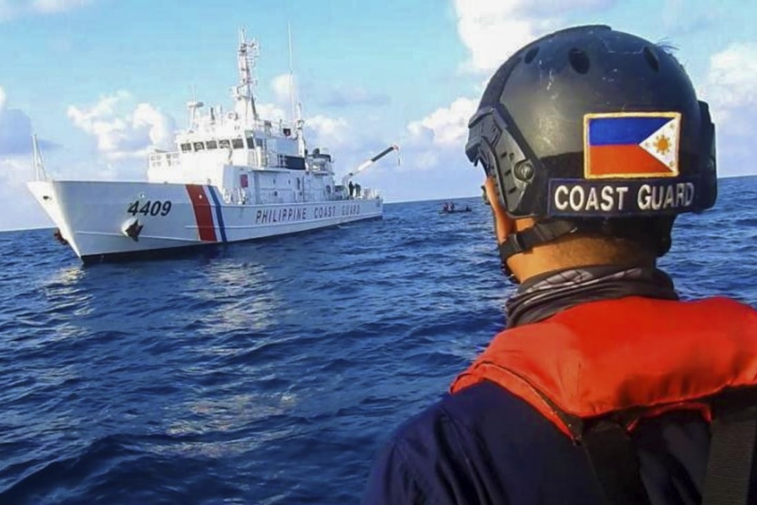 Members of the Philippine Coast Guard patrol at the Whitsun Reef in the South China Sea on April 14, 2021. Photo: Philippine Coast Guard via AP