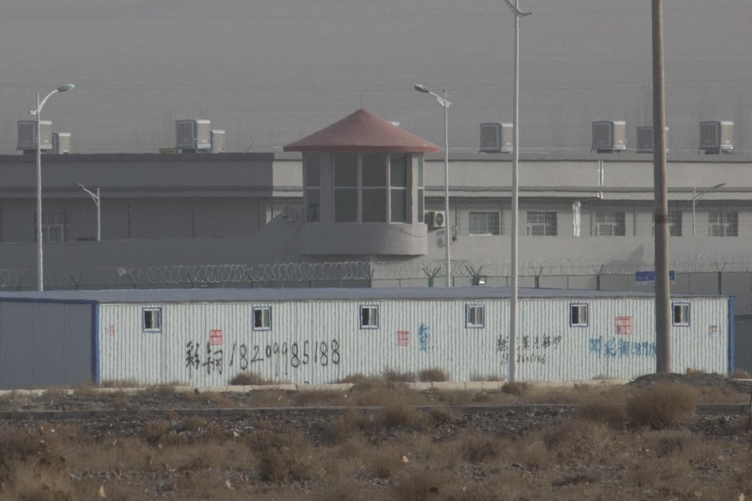 A guard tower and barbed wire fence are seen around a facility in the Xinjiang region, where China is accused of human rights abuses. Photo: AP