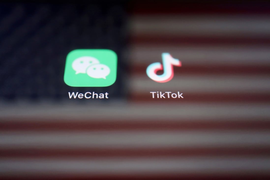 A reflection of the US flag is seen on the signs of the WeChat and TikTok apps in this illustration picture taken September 19, 2020. Photo: Reuters