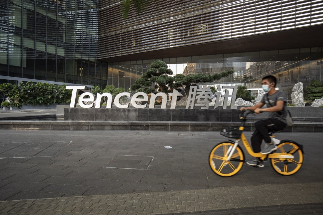 A cyclist rides past Tencent company's headquarters in Shenzhen, China. The company ranks No 5 on the list of most valuable brands in the world. Photo: Bloomberg