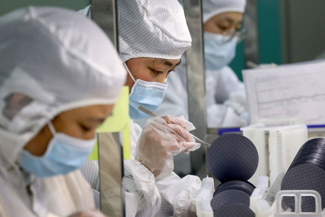 Employees make chips at a factory of Jiejie Semiconductor Company in Nantong, in eastern China’s Jiangsu province on March 17, 2021. Photo: AFP