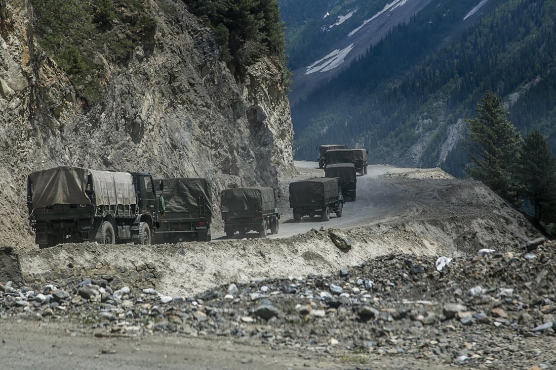 An Indian army convoy carries reinforcements and supplies through a high mountain pass bordering China in Ladakh, India, earlier this month. Photo: TNS