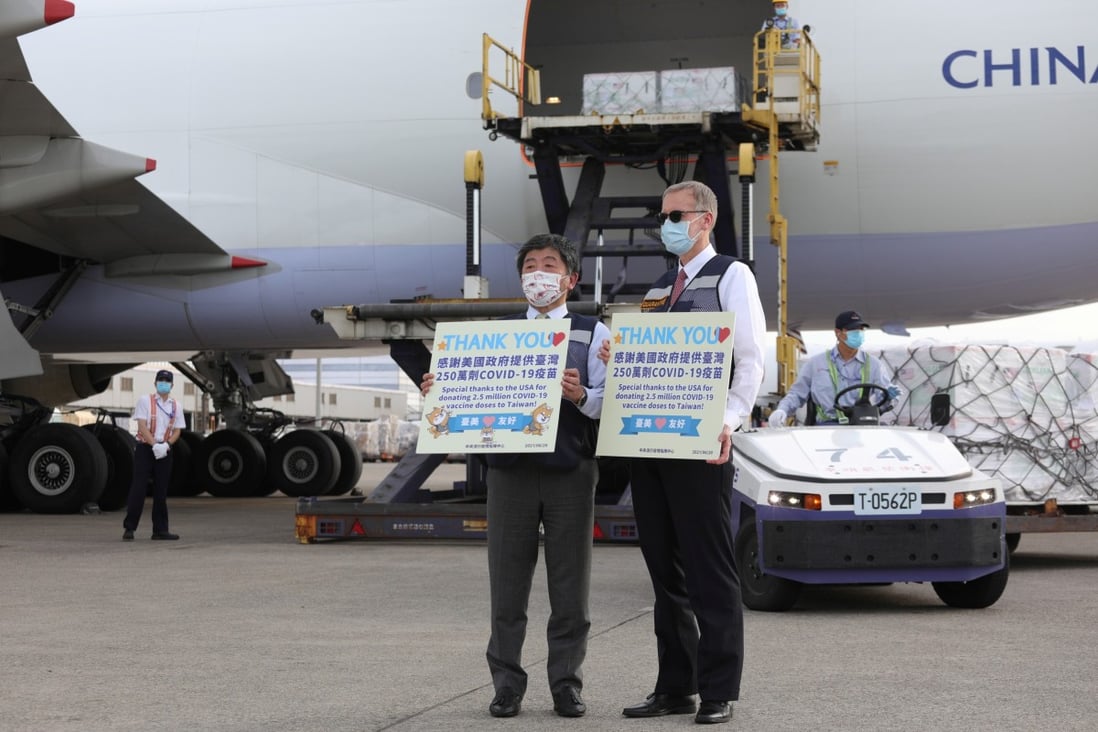 Taiwanese Health Minister Chen Shih-chung and the island’s top American diplomat, Brent Christensen, in front of an aeroplane carrying Moderna vaccines shipped from the US earlier this month. Photo: Reuters