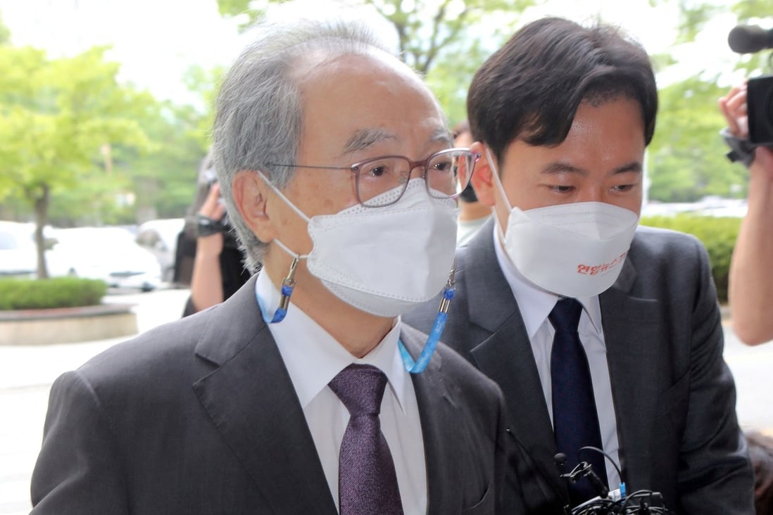 Oh Keo-don, left, arrives at a court to attend his trial on sexual harassment allegations in the southern port Busan on Tuesday. Photo: Yonhap via AFP