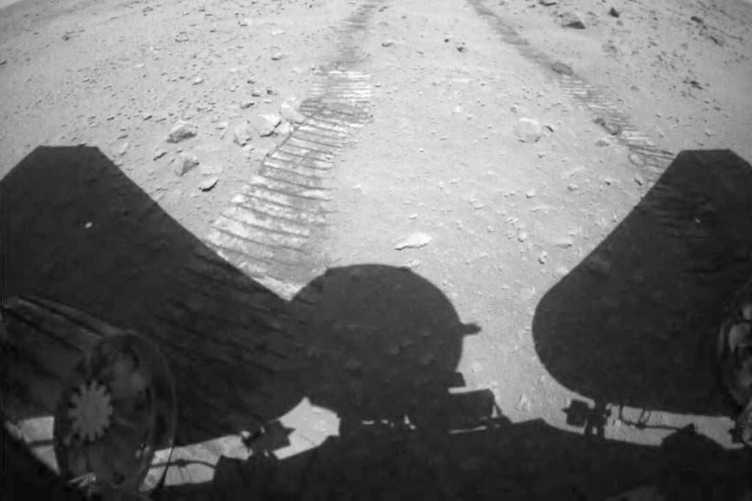 Mars rover Zhu Rong is shown in the video descending to the Martian surface and driving away from its landing platform. Photo: CNSA/Handout via Xinhua