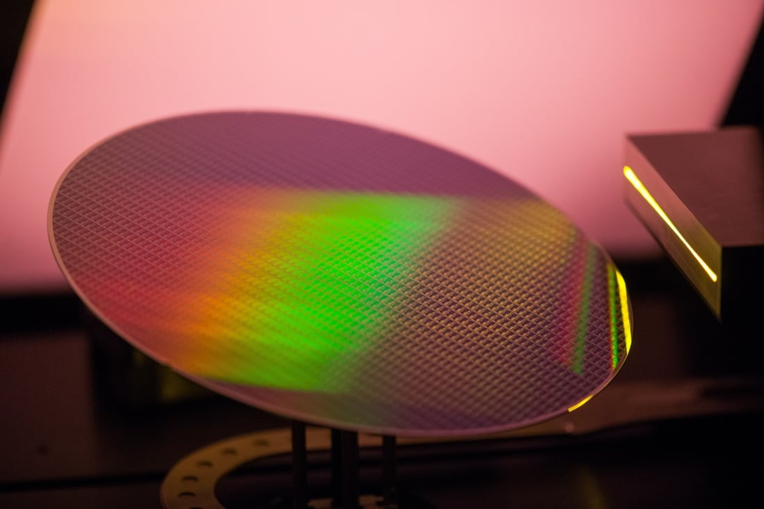 A 200 millimetre silicon wafer in a lithography scanner during manufacture at the X-Fab Silicon Foundries SE semiconductor plant in Corbeil-Essonnes, France, on June 1. Thinner wafers with stacked integrated circuits could be key to unlocking next-generation chip technology. Photo: Bloomberg