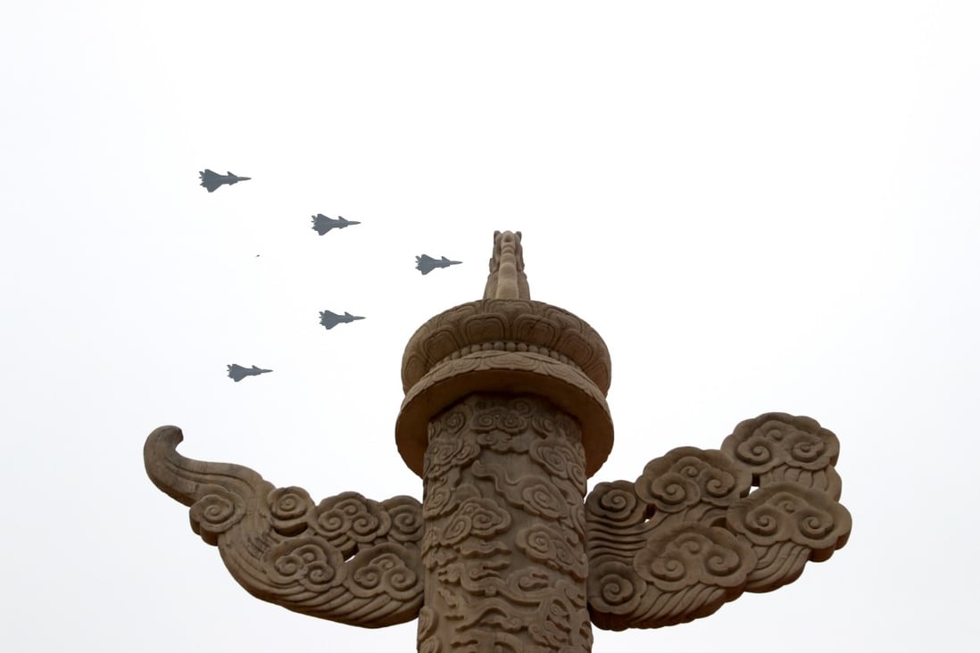 J-20s fly in echelons in the skies over Beijing. Photo: Xinhua