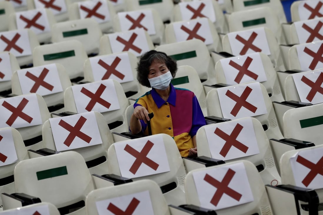 A resident rests for 15 minutes after getting a Covid-19 jab in New Taipei. The island is struggling to secure enough doses. Photo: EPA-EFE