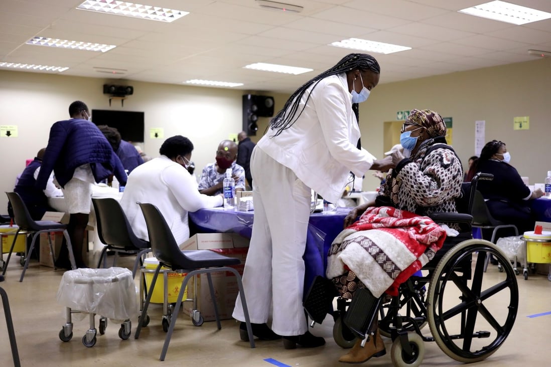 A woman receives a dose of a Covid-19 vaccine as South Africa rolls out vaccination to the elderly at the Munsieville Care for the Aged Centre outside Johannesburg. Photo: Reuters