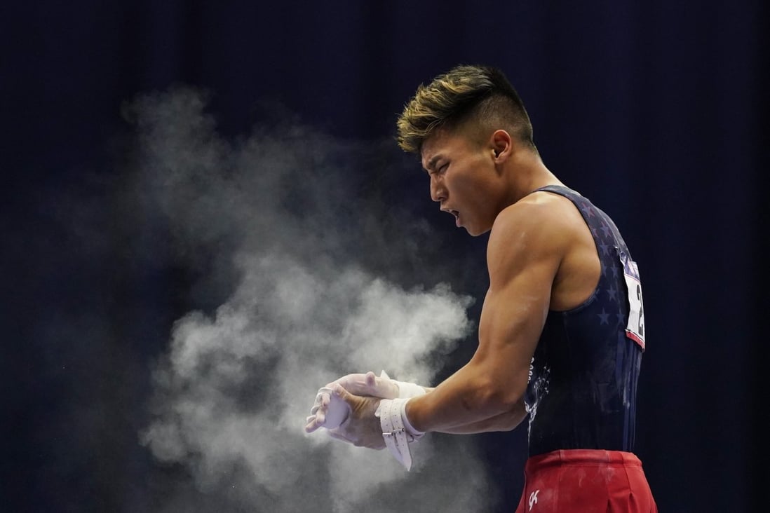 Yul Moldauer claps his hands after competing on the high bar at the Olympic trials in St. Louis. Photo: USA Today