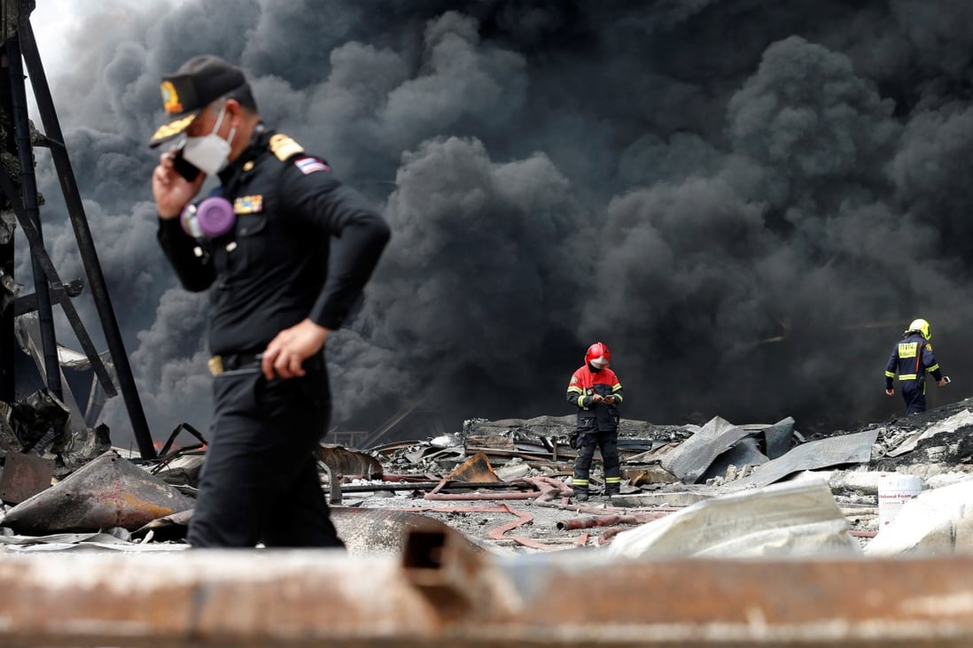 Workers extinguish a plastic factory after an explosion in Samut Prakan, on July 5, 2021. Photo: Reuters