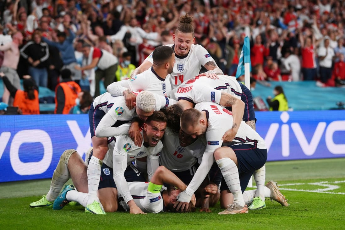 England's Harry Kane celebrates scoring their second goal against Denmark in the Euro 2020 semi-final with teammates. Photo: Reuters