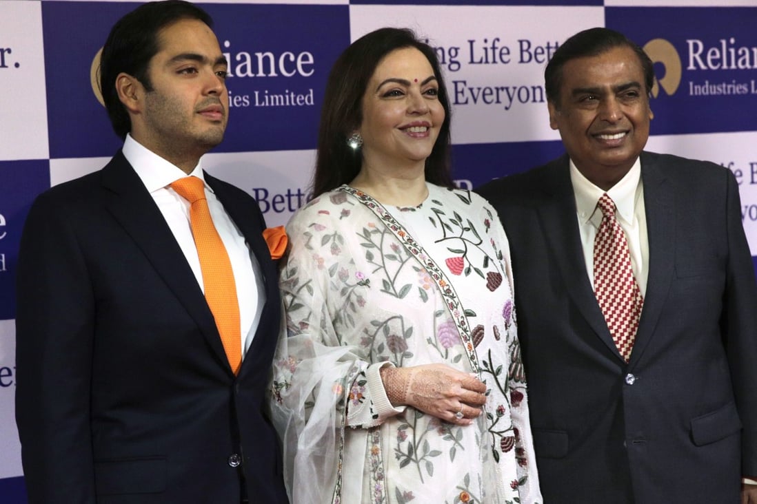 Anant Ambani, with parents Nita and Mukesh Ambani, pictured at the company's annual general meeting in Mumbai on July 5, 2018. Photo: AP